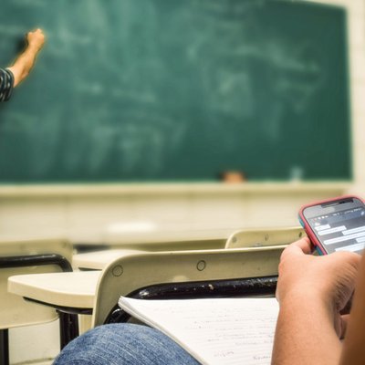 A student near the blackboard