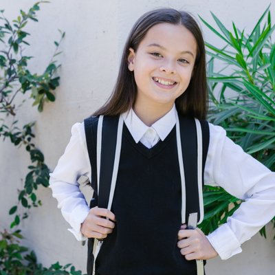 a pupil girl near the school